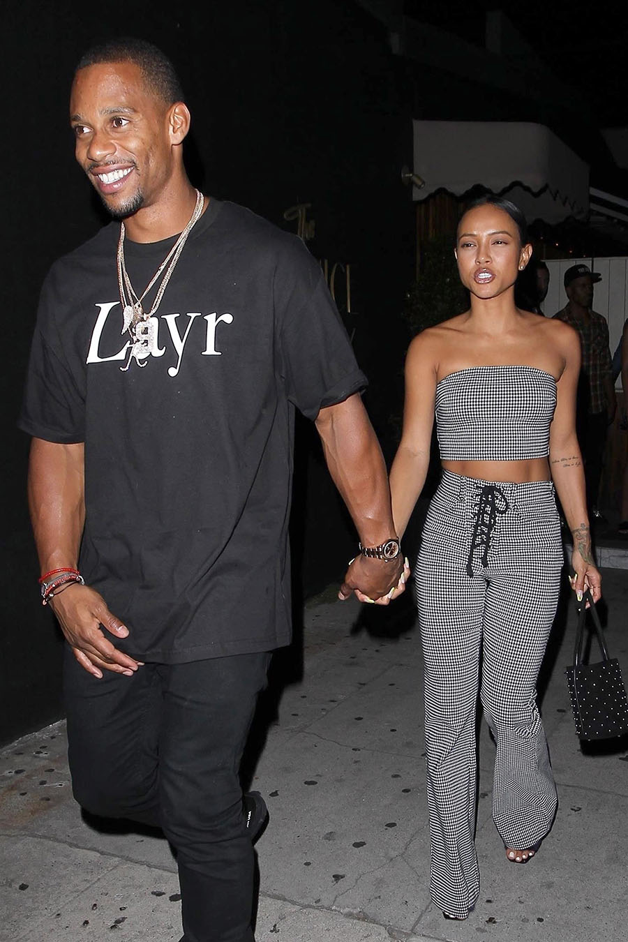 Karrueche Tran and Victor Cruz hold hands as they leave The Nice Guy