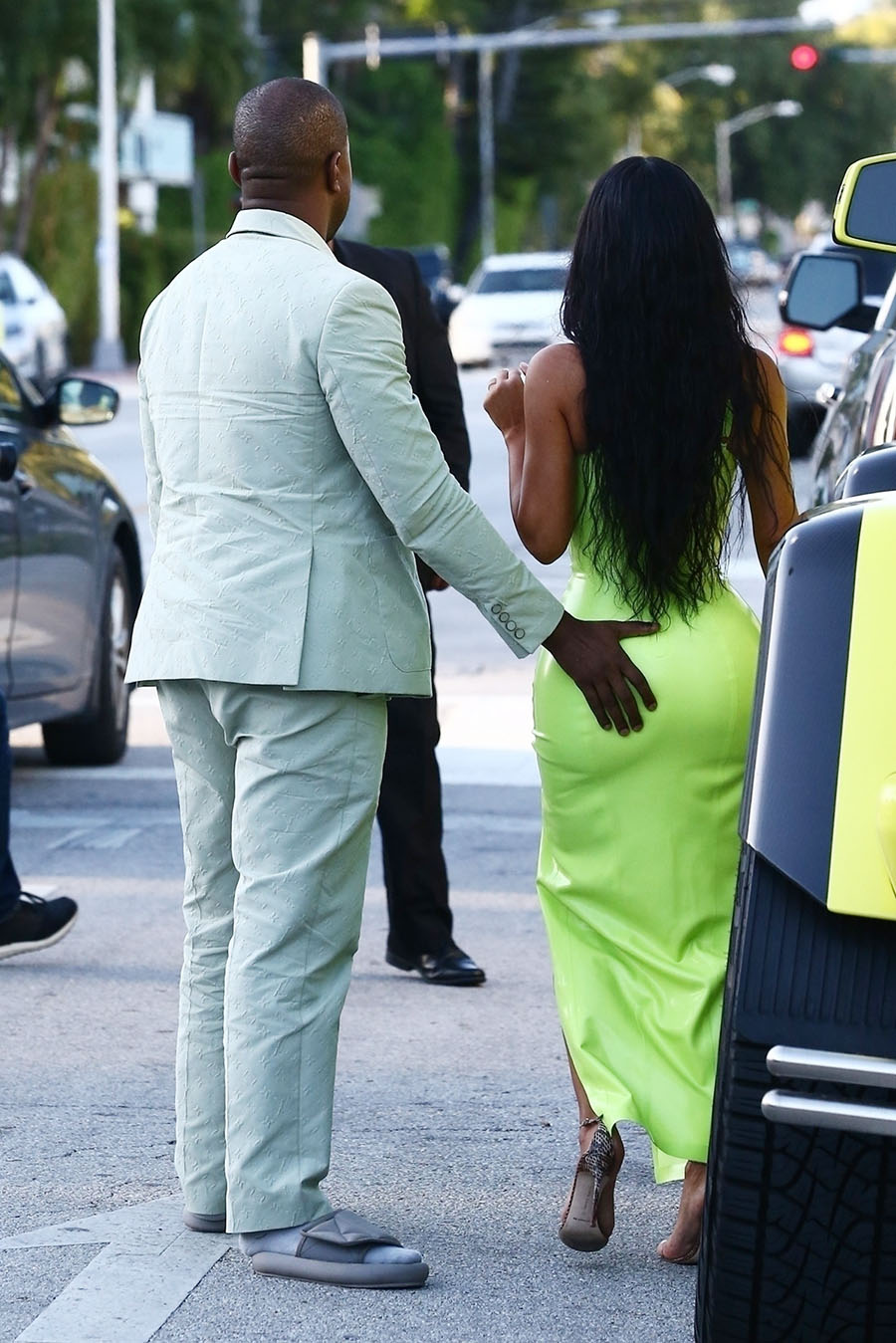 Kim Kardashian gets a helping hand from her man Kanye West while they