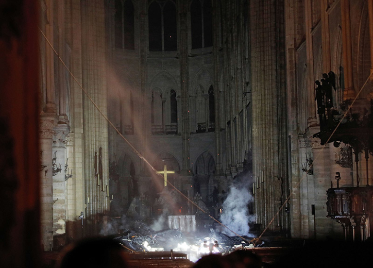 Smoke Rises In Front Of The Altar Cross At Notre-Dame Cathedral In ...