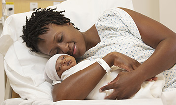 Stock Photo Black Woman Holding Newborn Baby In Hospital Bed Sandra