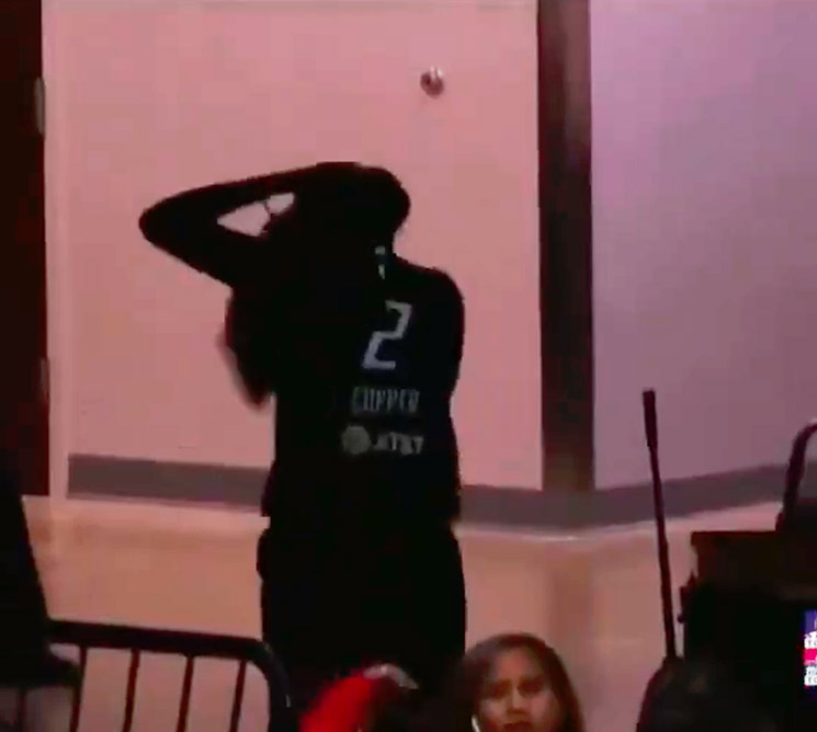 Photo of Kahleah Copper running with wig in hand