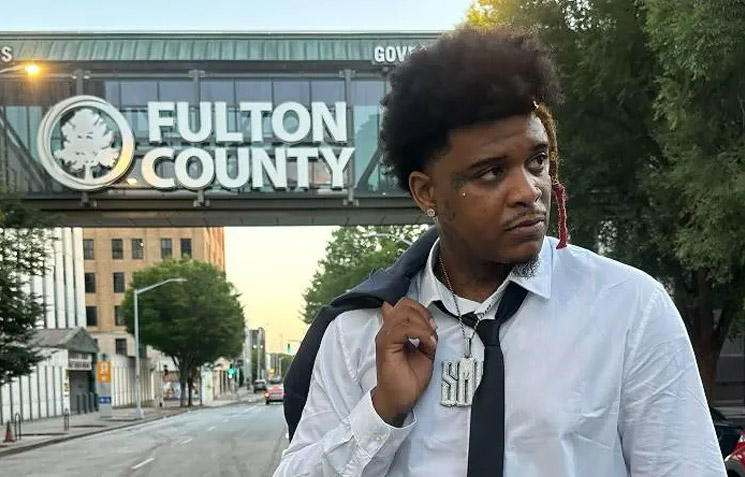 Photo of T-Hood in music video