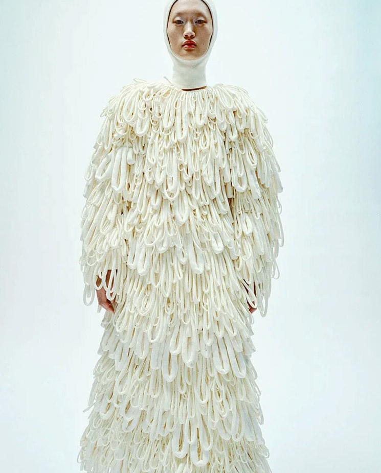 Photo of model wearing Moncler x Jill Sander coat