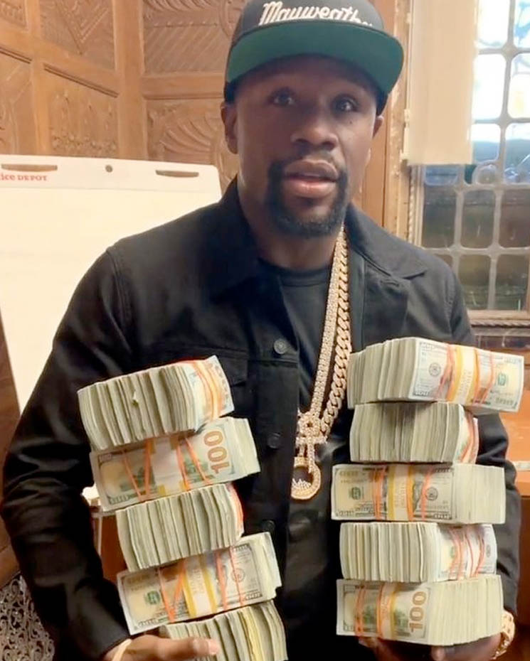 Photo of Floyd Mayweather Jr holding money