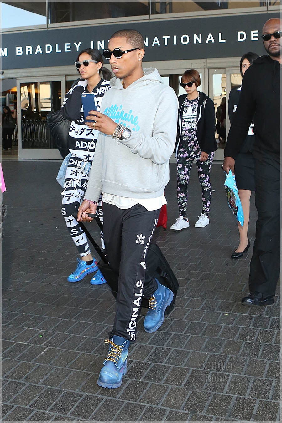 Pharrell Williams arrives a Los Angeles International Airport