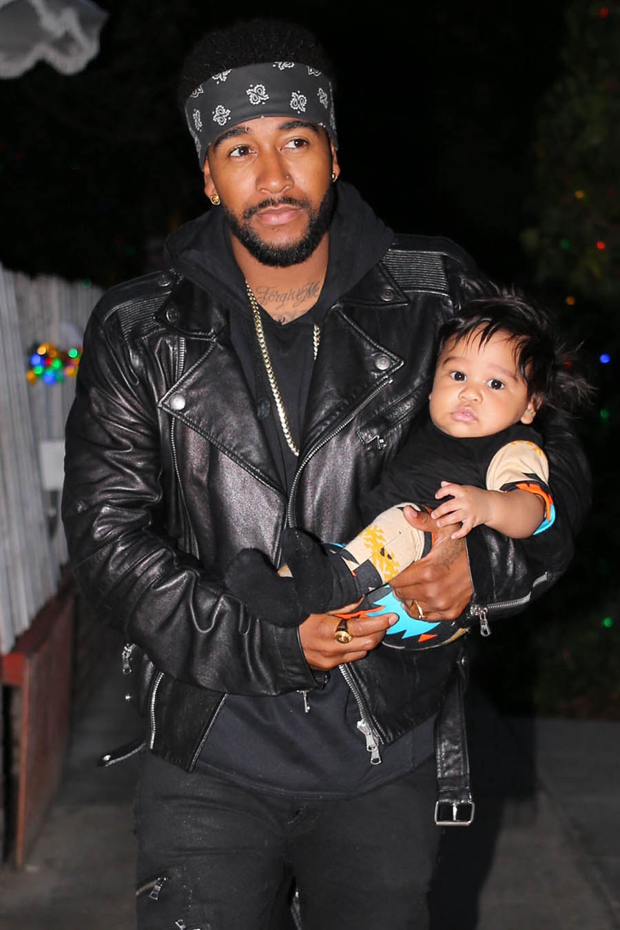 Omarion has dinner with his son.