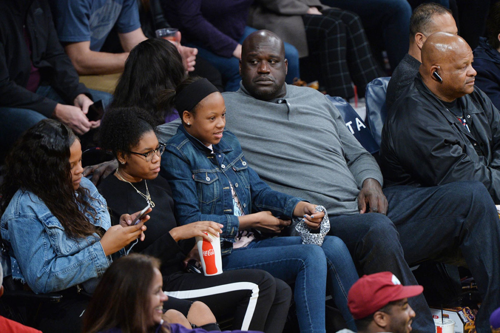 Shaquille O'Nea and family at Lakers vs Warriors game