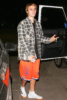 Justin Bieber stops to chat with photographers after leaving Selena Gomez's house