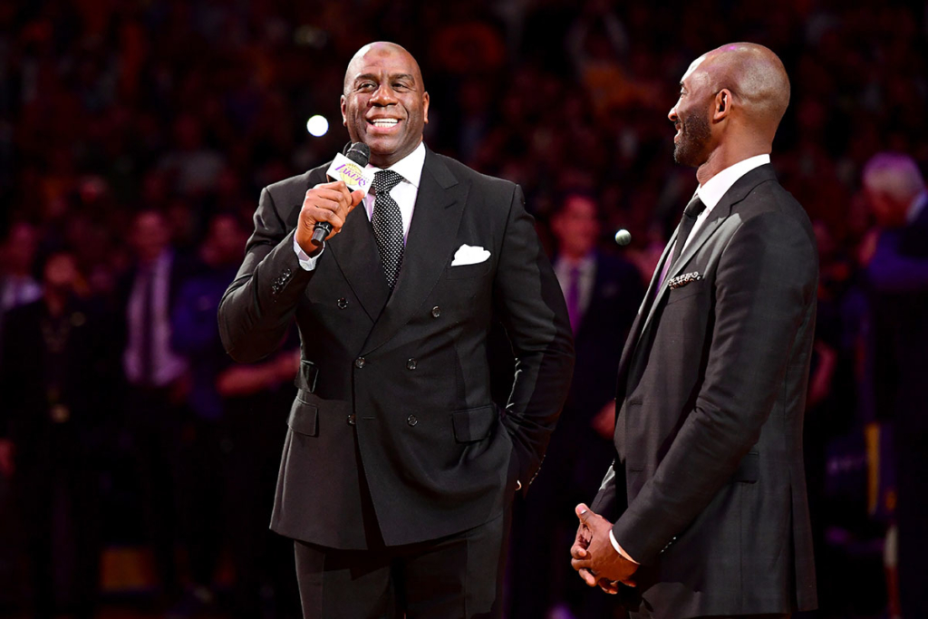 Earvin 'Magic' Johnson addresses the crowd before Kobe Bryant has his #8 and #24 Los Angeles Lakers jerseys retired