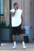 Tyga looked casual as he leaves Barneys New York with a friend