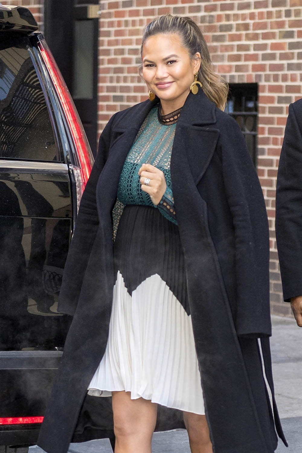 Chrissy Teigen arrives back home in NYC