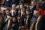 Members of Congress wear black clothing and Kente cloth in protest before the State of the Union address
