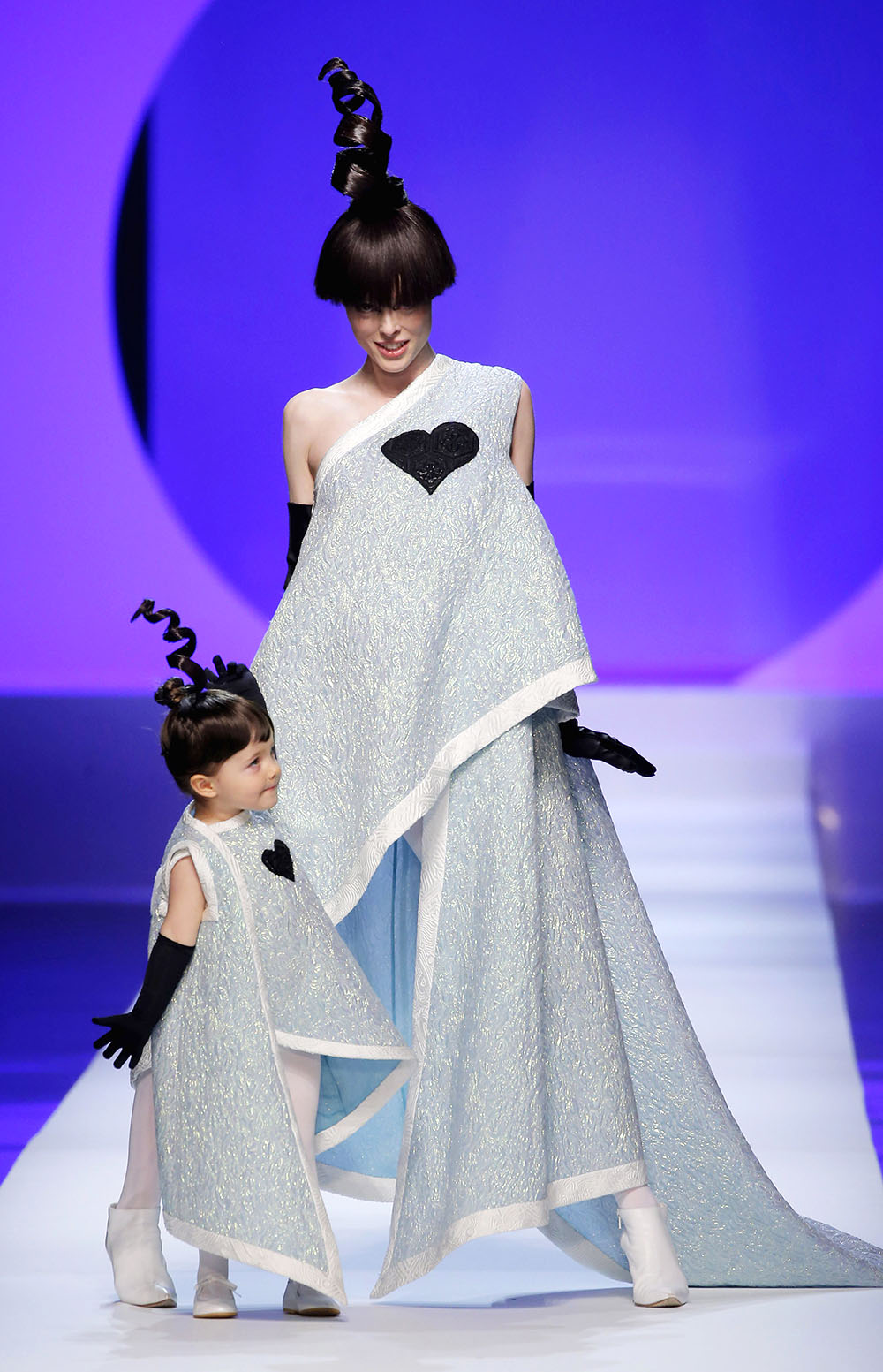 Coco Rocha and her daughter Ioni walk for Jean-Paul Gaultier