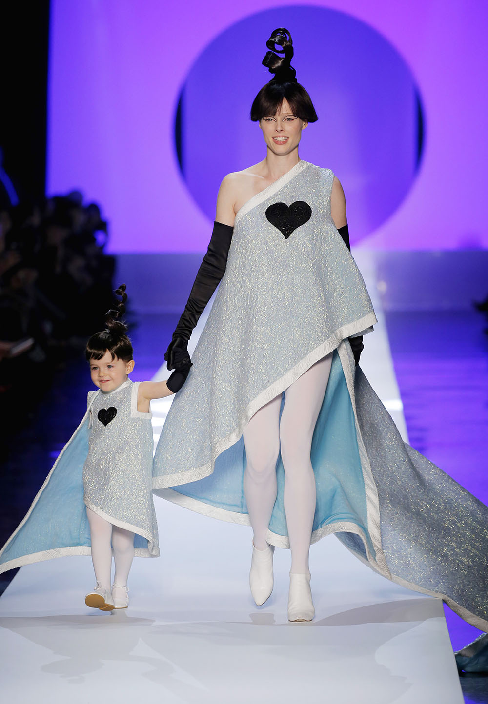 Coco Rocha and her daughter Ioni walk for Jean-Paul Gaultier