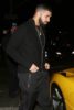 Drake hops into his $7 million Yellow Ferrari