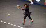 Serena Williams plays against Venus in the tennis tournament in New York City