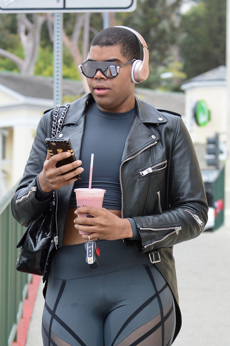 EJ Johnson shows off his curves in skintight leggings with sheer panels. 