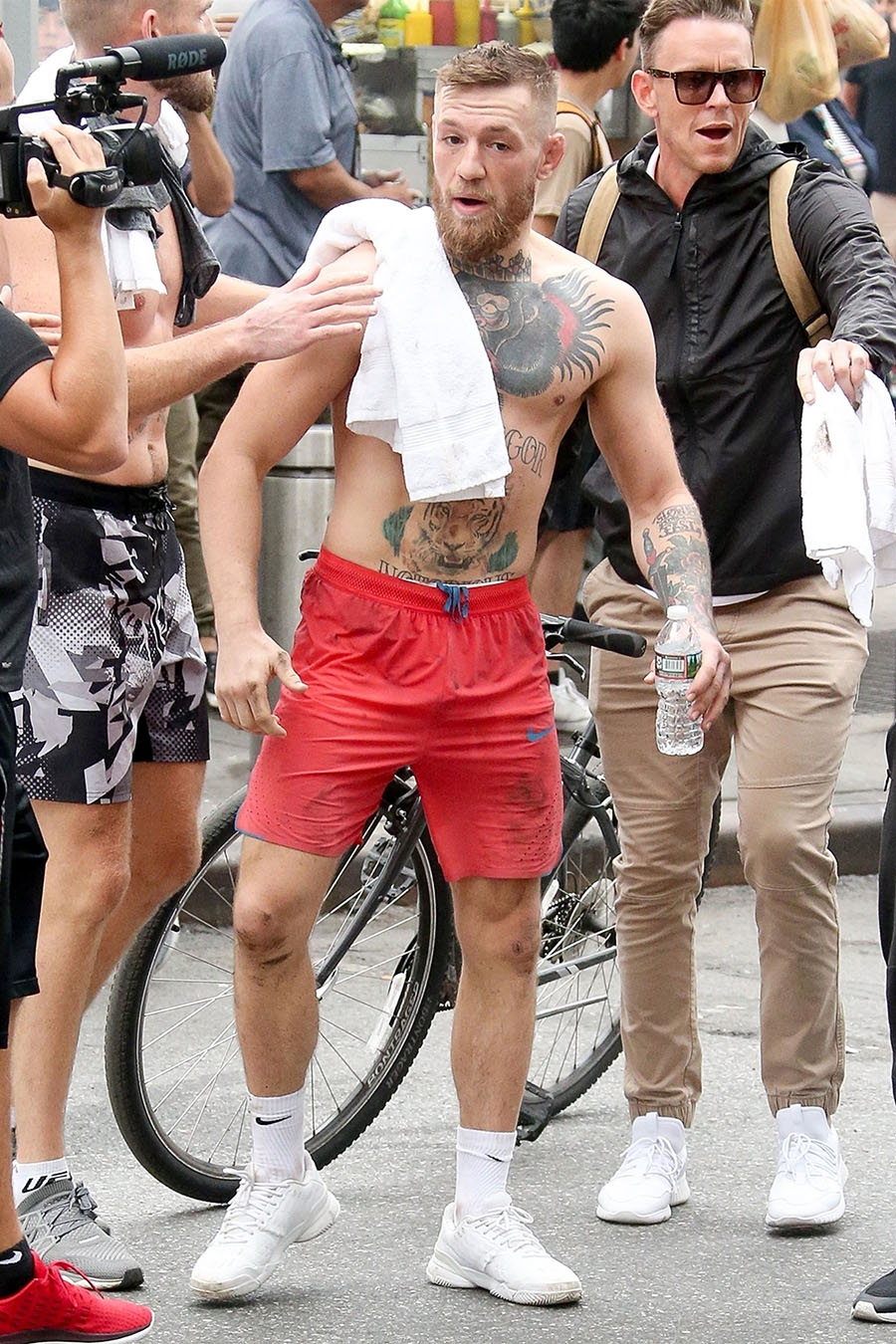 Mma Fighter Conor Mcgregor Was Seen Walking Shirtless With An Entourage Around Him Through The