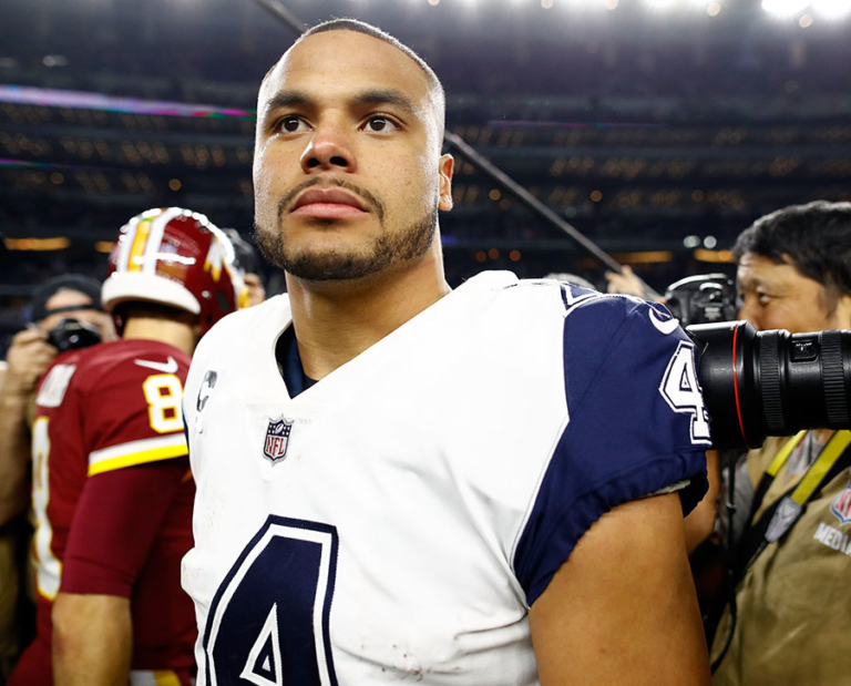 Dak Prescott #4 of the Dallas Cowboys walks off the field after the 38 ...