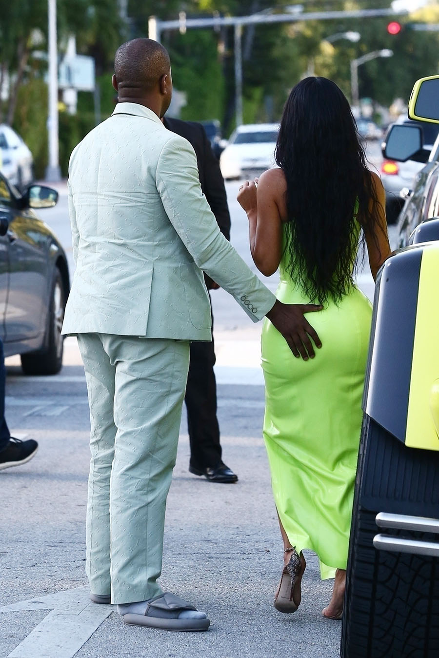 Kim Kardashian gets a helping hand from her man Kanye West while they 