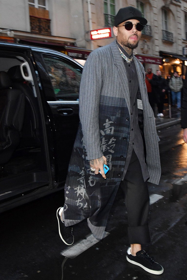 Chris Brown is all smiles while leaving the Mandarin Oriental Hotel in ...