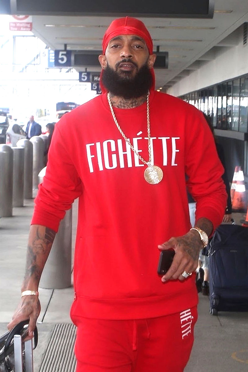 Nipsey Hussle is seen departing on a flight at LAX airport in Los ...