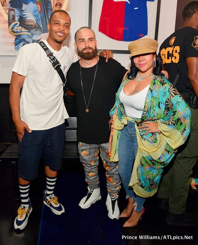 T.I. Harris poses with Brooklyn artist Brian Kirhagis and Tameka Tiny ...