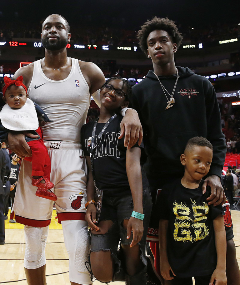 Dwyane Wade #3 of the Miami Heat poses for a photo with his wife