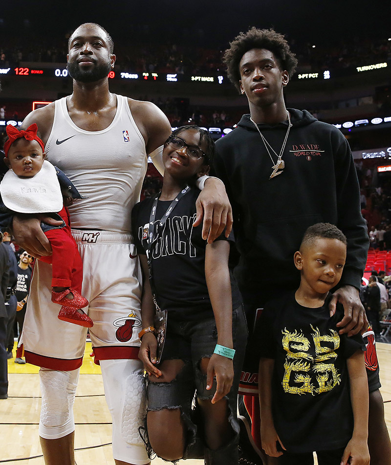 Dwyane Wade #3 of the Miami Heat poses for a photo with his wife