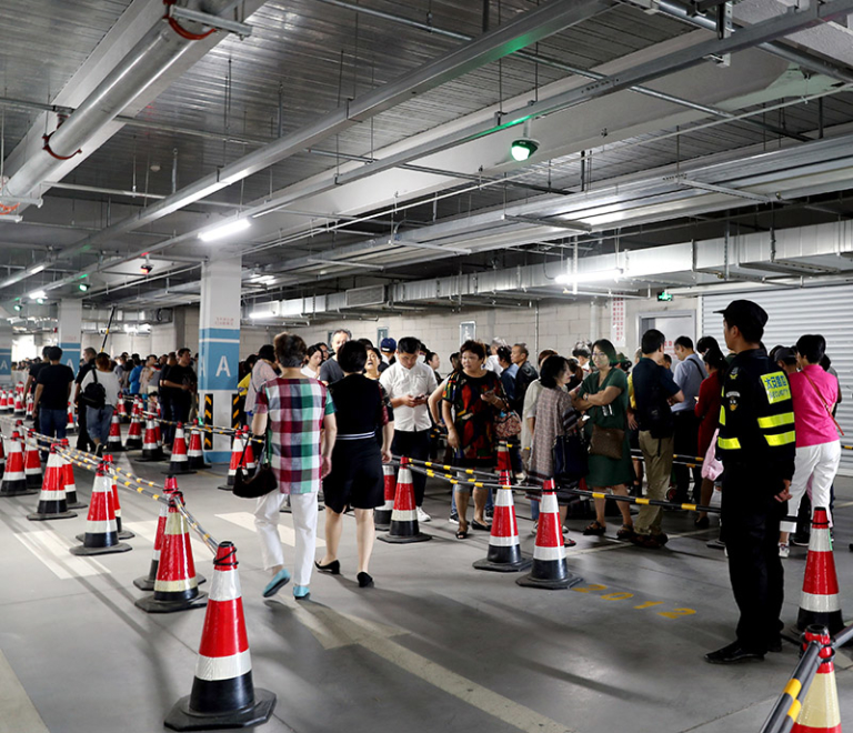 Customers wait in lines to enter a Costco warehouse store in Minhang ...