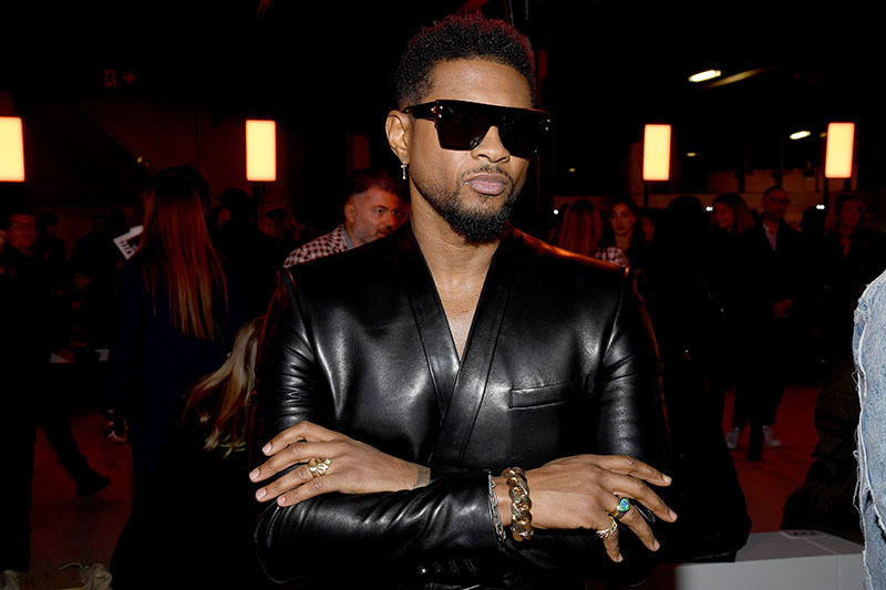 Usher attends the Balmain show as part of the Paris Fashion Week