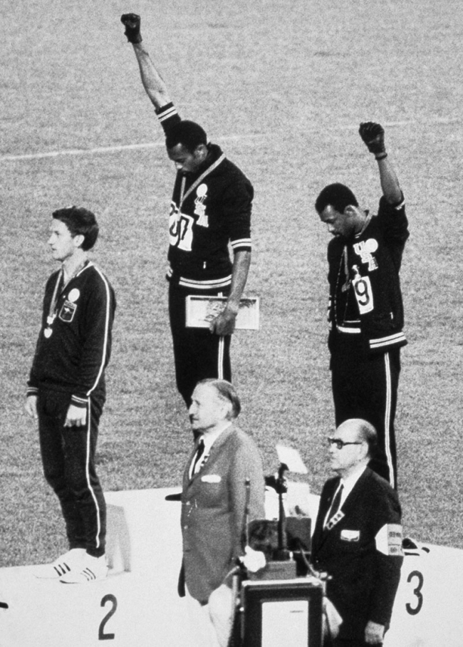 American Sprinters Tommie Smith And John Carlos Raise Their Fists And ...