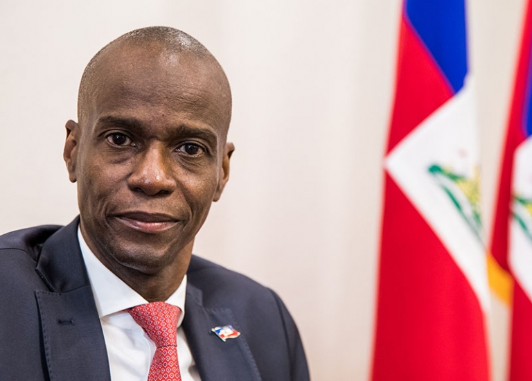 President Jovenel Moise sits at the Presidential Palace during an