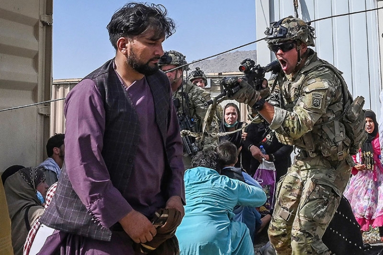 A US Soldier C Point His Gun Towards An Afghan Passenger At The Kabul   US Soldier C Point His Gun At The Kabul Airport GettyImages 1234712701 768x512 