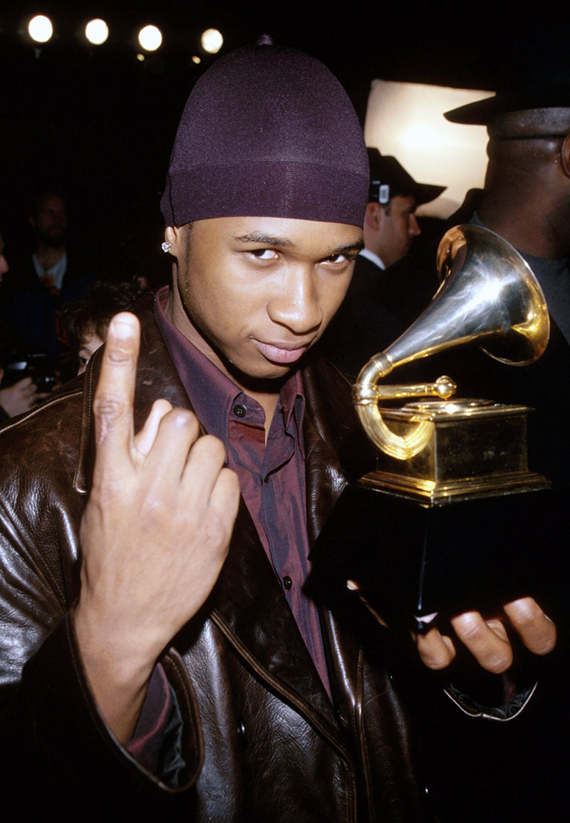 Usher poses with his Grammy Award at The 40th Annual GRAMMY Awards