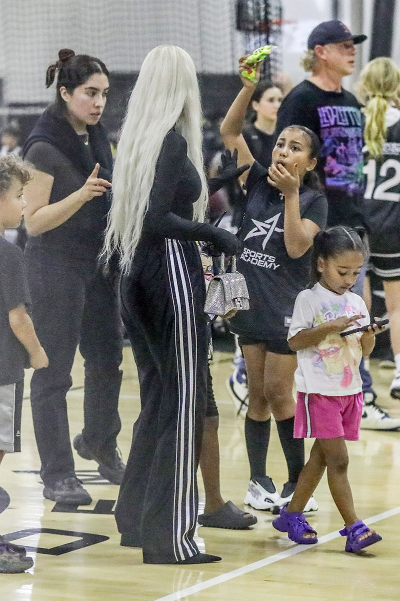 Kim Kardashian & Kanye West Put On Affectionate Display At Son Saint's  Basketball Game