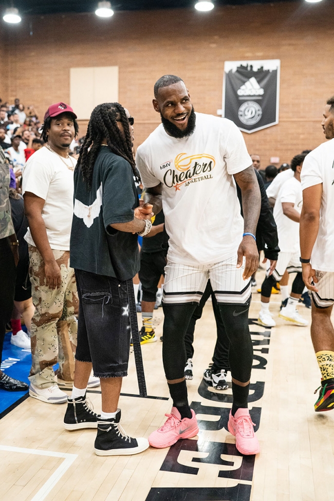 LOS ANGELES, CALIFORNIA – JULY 16: Quavo shakes hands with LeBron James ...