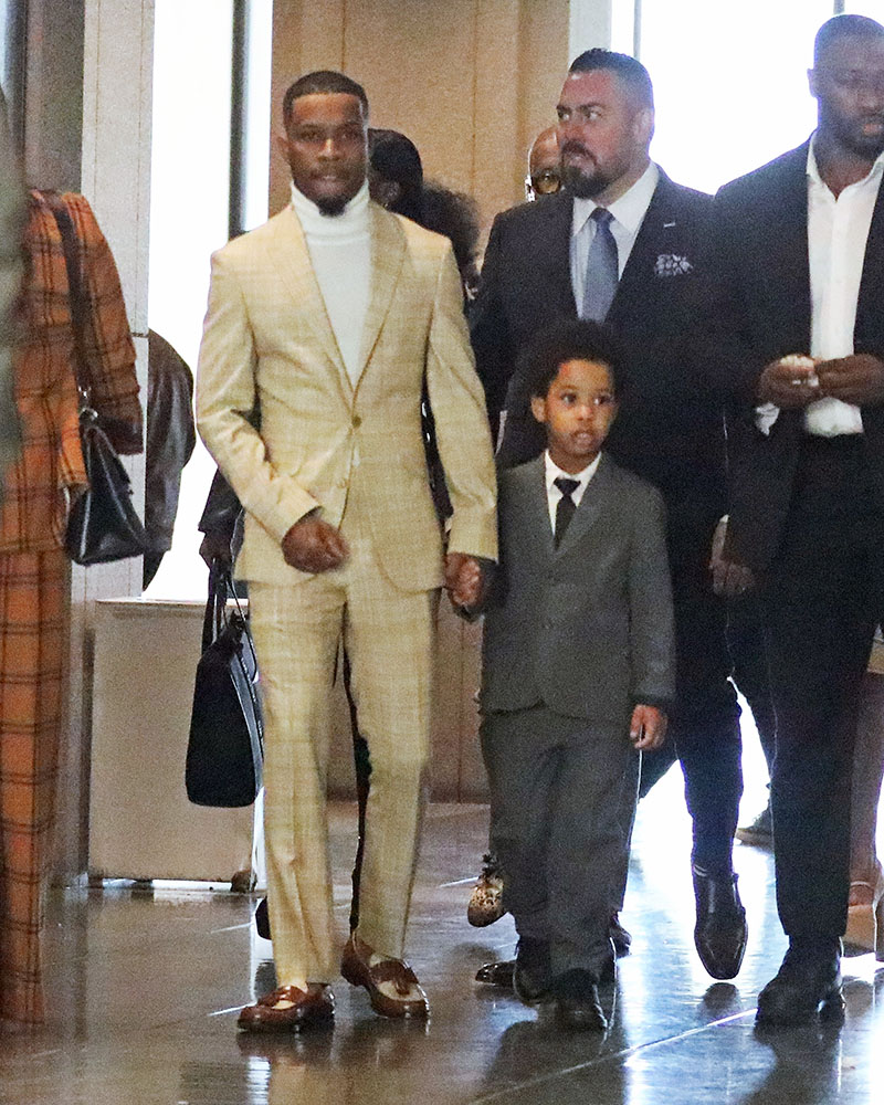 Tory Lanez arrives hand in hand with his son Kai to court today as ...