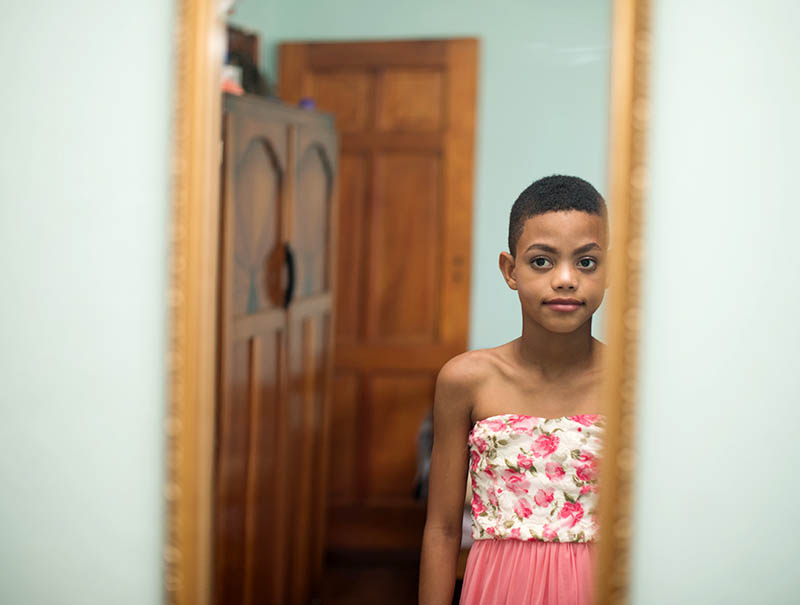 Clown World topic STOCk-transgender-boy-wearing-dress-in-mirror-GettyImages