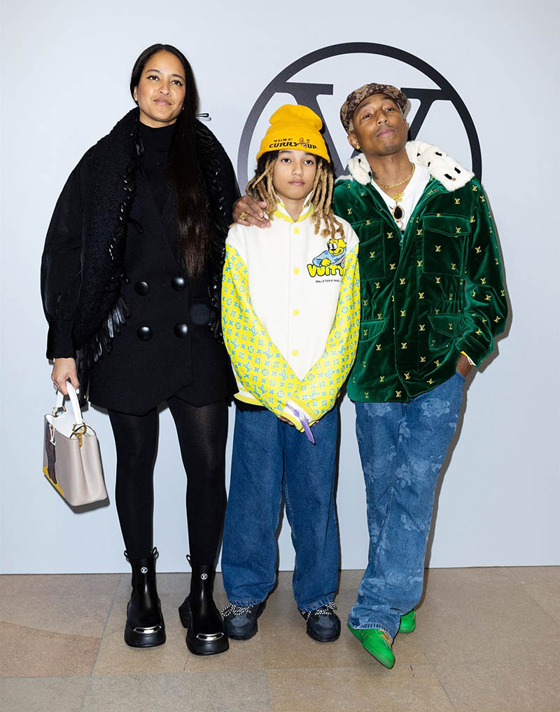 Helen Lasichanh, from left, Rocket Ayer Williams and Pharrell Williams  arrive for the Off-White Ready To Wear Fall/Winter 2022-2023 fashion  collection, unveiled during the Fashion Week in Paris, Monday, Feb. 28,  2022. (