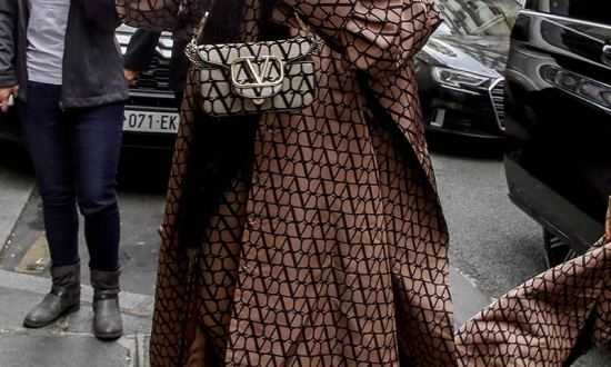 Kendrick Lamar with actress Lupita Nyong'o at Paris Fashion Week.