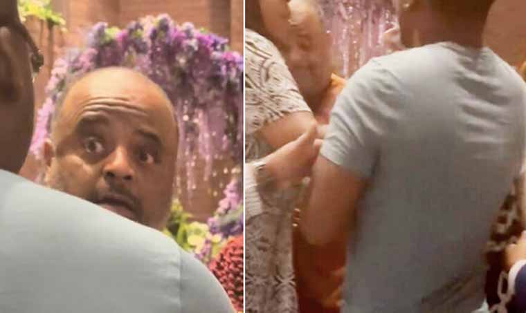 Roland Martin hides behind woman when confronted at DNC