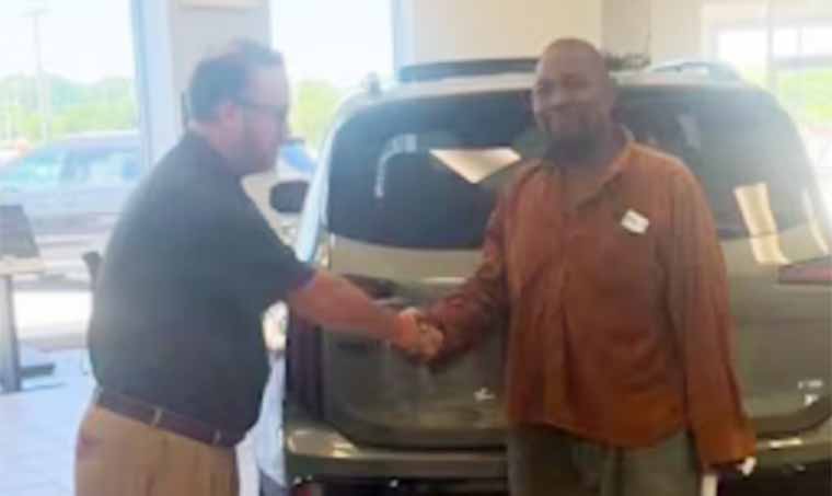 Man arrested after trying to buy two SUVs with dead person’s ID