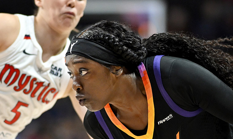 Phoenix Mercury star Khaleah Copper runs off the court after losing her wig