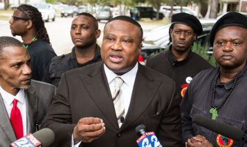 Community activist Quanell X, center, speaks to the media concerning the case against Shannon Miles, the alleged killer of Harris County Sheriff’s Deputy Darren Goforth, during a news conference on Sunday, Feb. 14, 2016, in Houston. Quanell X said he is seeking the investigation into the deputy’s killing be taken over by Texas Rangers. He also said he wants Miles’ trial to be moved out of Harris County. ( Brett Coomer / Houston Chronicle ) (Photo by Brett Coomer/Houston Chronicle via Getty Images)