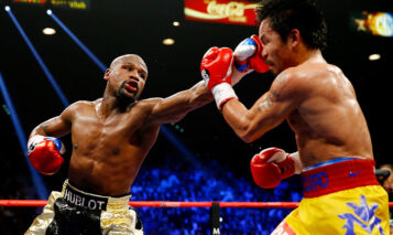 LAS VEGAS, NV – MAY 02:  Floyd Mayweather Jr. throws a left at Manny Pacquiao during their welterweight unification championship bout on May 2, 2015 at MGM Grand Garden Arena in Las Vegas, Nevada.  (Photo by Al Bello/Getty Images)