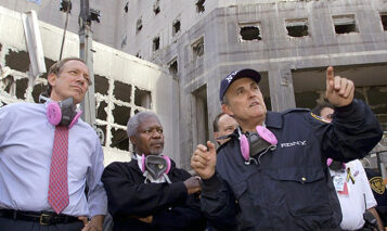 New York Mayor Rudolph Giuliani (R) gives a tour of the World Trade Center attack site to UN Secretary-General Kofi Annan (C) and New York Governor George Pataki (L) 18 September, 2001, in New York.   AFP PHOTO/POOL/Timothy A. CLARY (Photo by Timothy A. CLARY / AFP POOL / AFP) (Photo by TIMOTHY A. CLARY/AFP POOL/AFP via Getty Images)